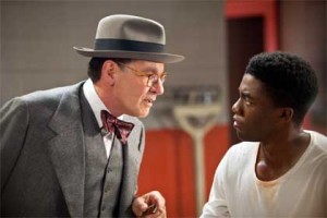 Harrison Ford as Branch Rickey, Chadwick Boseman as Jackie Robinson in '42: The True Story of An American Legend'