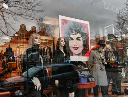 Jackie Onassis poster in store window, photo by Christopher Bullock